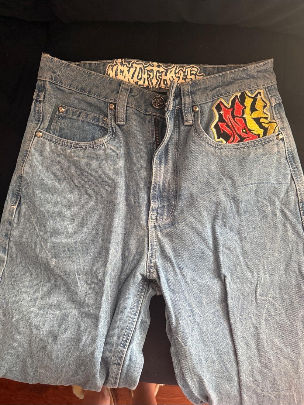 Relaxed Light Blue Denim Jeans with Red & Yellow Pocket Accent